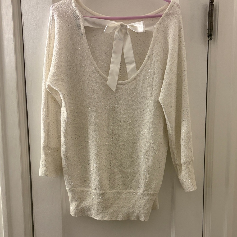 White House Black Market white sparkly sweater with bow in back